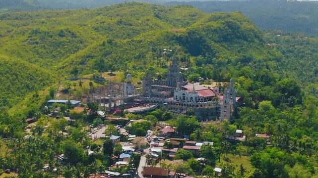 4K Drone Footage Of Simala Church, Aerial View
 Soar above this magnificent church, capturing its unique architecture, intricate details, and serene surroundings.