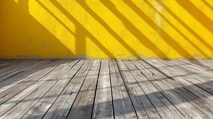 Empty yellow room with wooden floor and shadows