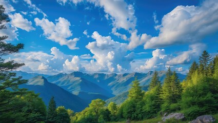 Mountain landscape with lush green trees and dramatic cloud formations under a bright blue sky. Scenic view of rolling hills and valleys.