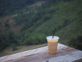 Close up Take away glass of cappuccino coffee