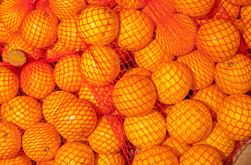 oranges from Turkey in a net in a supermarket in a container
