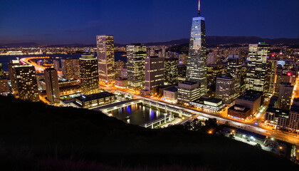 Fototapeta premium Vibrant city skyline illuminated at night, urban beauty