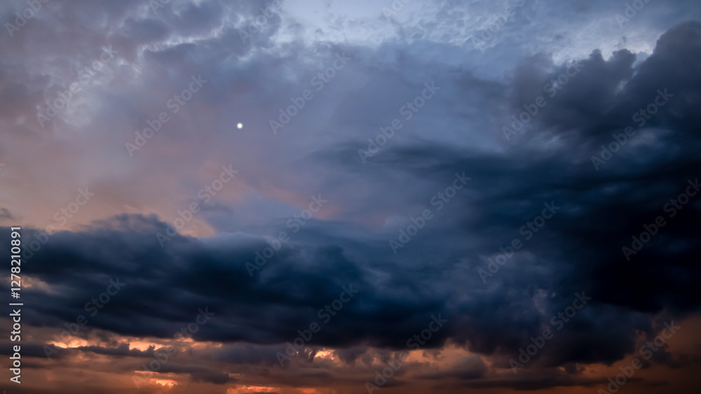 Wall mural dark sky with stormy clouds. dramatic sky rain,dark clouds before a thunder-storm.