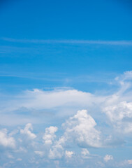 Obraz premium clear blue sky background,clouds with background, Blue sky background with tiny clouds. White fluffy clouds in the blue sky. 