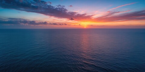 Obraz premium Aerial Ocean View at Twilight with Vibrant Sunset Colors and Empty Space for Text or Graphic Elements