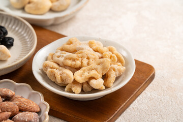 Flavored mixed nuts in bowls.