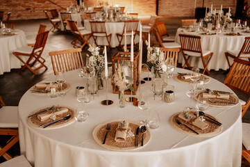 elegant wedding table setup with rustic decorations and candles