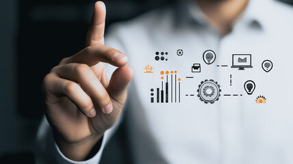 Digitization at your Fingertips: An executive in a modern office setting interacts with data, illustrating the power of innovation and connectivity. The image shows a close-up of a hand gesture.