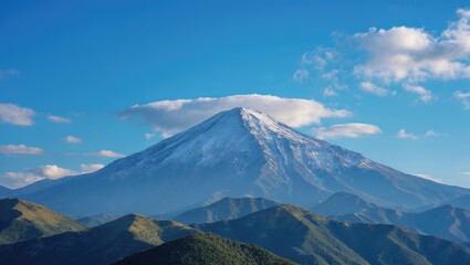 Fototapeta premium Majestic Snow-Capped Mountain Beneath a Clear Blue Sky with Wispy Clouds and Lush Green Hills in the Foreground on a Sunny Day