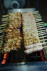 Pork marinated in sour sauce, skewered and grilled, called grilled naem, is another food that Thai people like to eat.