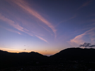 Aerial view of beautiful sunset or sunrise sky over mountains