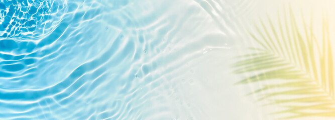 abstract sand beach with blue transparent water wave and palm leaf shadow on sunny tropical...