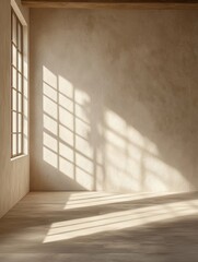 Serene interior with sunlight streaming through window casting shadows on textured wall and wood floor creating peaceful ambiance