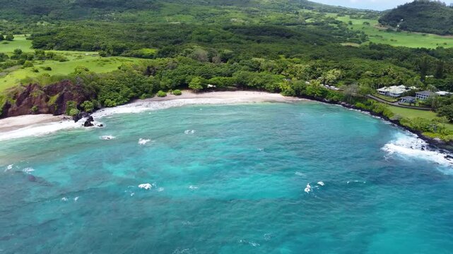 Hamoa Beach Hana Maui Hawaii &ndash; Stunning cinematic footage of clear blue water, powerful waves, and lush Hana landscapes. Aerial view captures this iconic Maui surf spot in all its natural beauty.