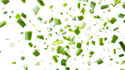 Chopped green onions falling on a transparent background.  The pieces vary in size and shape, PNG