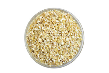 Barley groats in glass container isolated on PNG background.