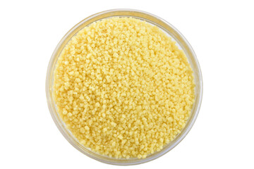 Couscous groats in glass bowl isolated on white background.