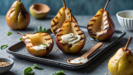 Grilled Pear Halves with Cream and Mint Garnish on a Dark Tray with Empty Copy Space for Ad Promotions or Recipes