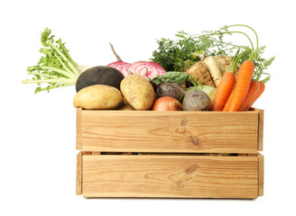 Different root vegetables in wooden crate isolated on white