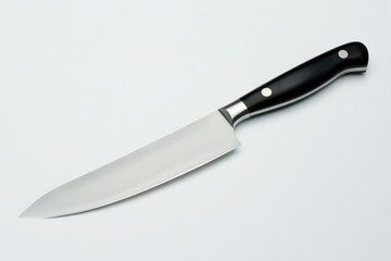 Fototapeta premium Kitchen knife with black handle lies on white background