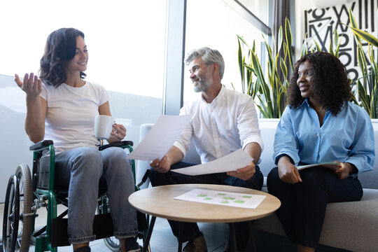 Manager leading planning session with diverse colleagues showcasing teamwork