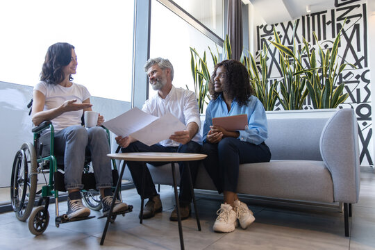 Manager leading planning session with diverse colleagues showcasing teamwork - Powered by Adobe