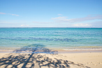 Idyllic beach close to Le Morne Brabant mountain, showcasing pristine sands and clear blue waters in Mauritius