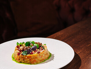 Delicate dish with vibrant garnish on elegant plate