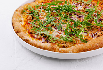 Fresh tuna and arugula pizza on white background