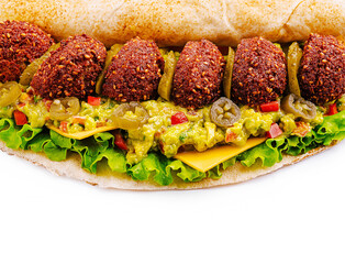 Delicious falafel sub sandwich with fresh toppings and sauces