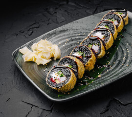 Delicious sushi rolls served on a stylish plate