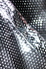 Industrial foil shiny background with rivets and crumpled lines