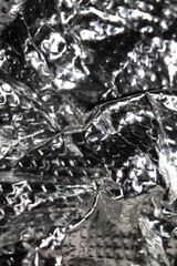 Industrial foil shiny background with rivets and crumpled lines