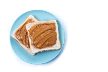 Bread toast with peanut butter cream isolated on white background. Top view. Copy space