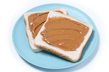 Bread toast with peanut butter cream isolated on white background