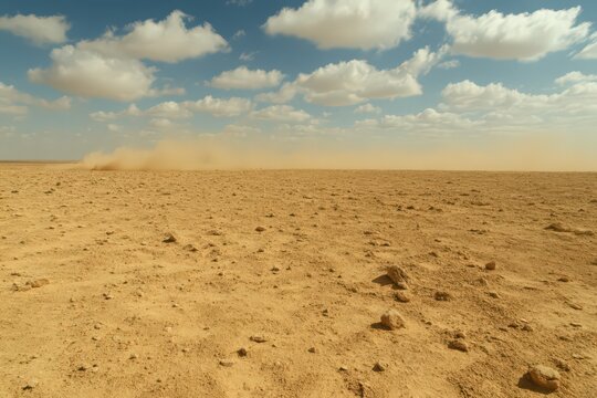 Arid Desert Landscape Under Partly Cloudy Sky