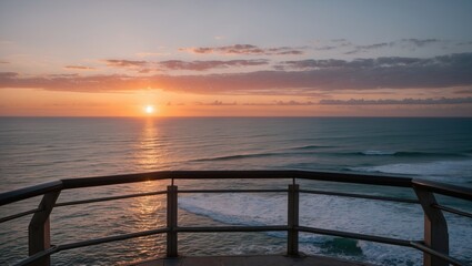 Fototapeta premium Serene Sunset Over Ocean from Scenic Walkway with Vibrant Sky and Reflection on Water