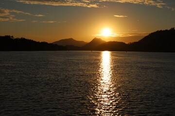 Naklejka premium Golden sunset on the mekong river luang prabang laos