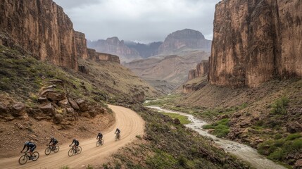 Cyclists Journeying Through Dramatic Canyon Landscape on Dusty Path