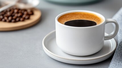 Fototapeta premium Savoring aromatic black coffee in a minimalist setting with roasted beans