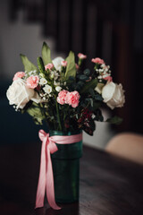 Bouquet of roses and carnations in a vase
