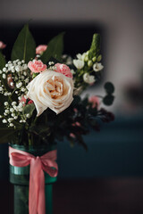 Bouquet of roses and carnations in a vase
