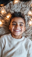 Child smiles on fuzzy rug, lights around head, cozy home, portrait
