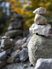 A carefully stacked stone cairn in a peaceful forest setting, symbolizing balance, mindfulness, and meditation. A perfect nature-inspired image for wellness, travel, and outdoor adventure themes	