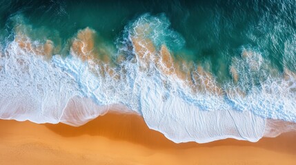 A stunning aerial view showcases a pristine beach where waves gently crash onto the sandy shore, highlighting the beauty of nature's coastline.