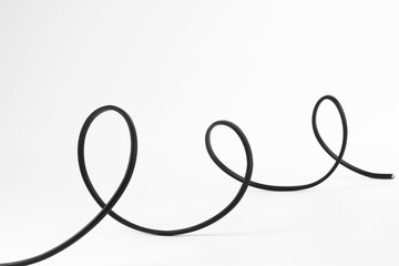 Naklejka premium One black electrical wire isolated on white