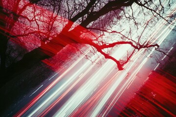 A blurry image of a tree lit up by red lights, great for use in nighttime or holiday-themed designs