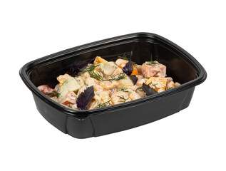 A black plastic container with salad on a white background