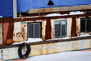 Small ship moored at Ust-Kamenogorsk reservoir. Very Old boat. Close-up. East kazakhstan region