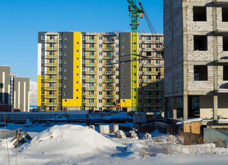 Modern apartment buildings under construction. Architectural background. Construction crane. Contemporary architecture. Construction concept. Ust-Kamenogorsk (kazakhstan)